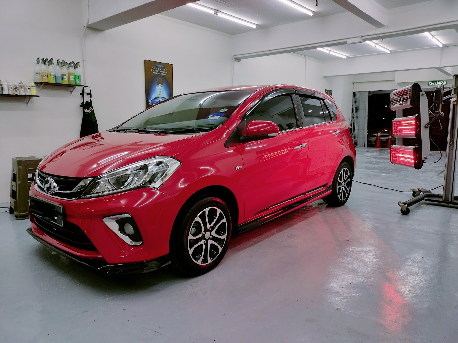 Finished glossy red Myvi in the Ria Auto Detailing studio